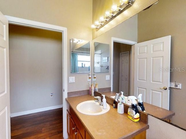 bathroom with vanity and hardwood / wood-style flooring