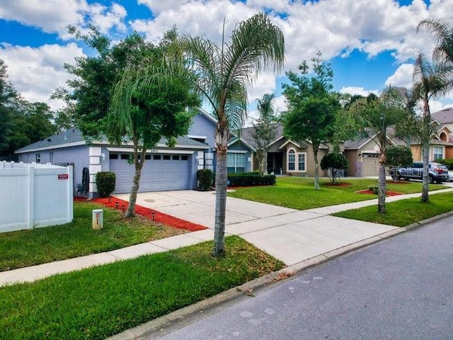 single story home featuring a front yard and a garage