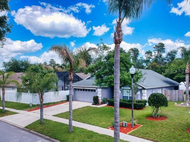 view of front facade featuring a garage and a front lawn