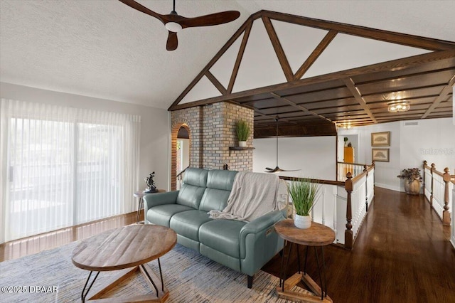 living room featuring hardwood / wood-style floors, a textured ceiling, ceiling fan, and lofted ceiling