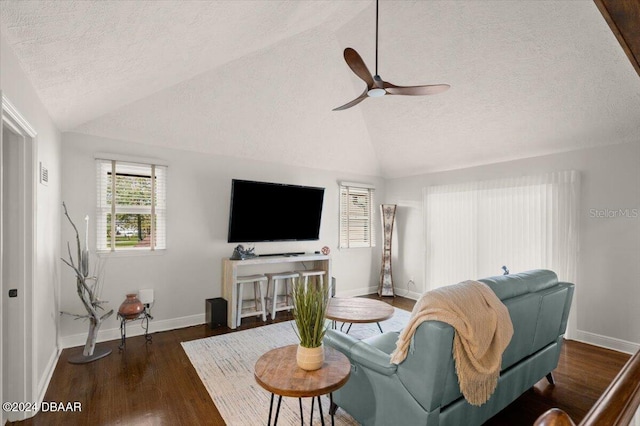 living room with a textured ceiling, ceiling fan, dark hardwood / wood-style flooring, and lofted ceiling