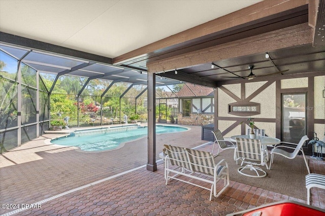 view of swimming pool with a lanai and a patio area