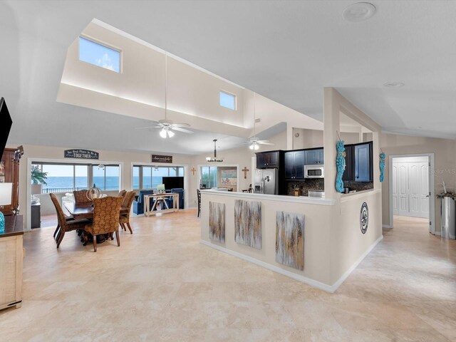 living room with vaulted ceiling and ceiling fan