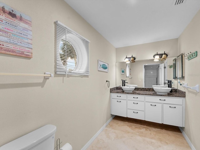 bathroom with vanity and toilet