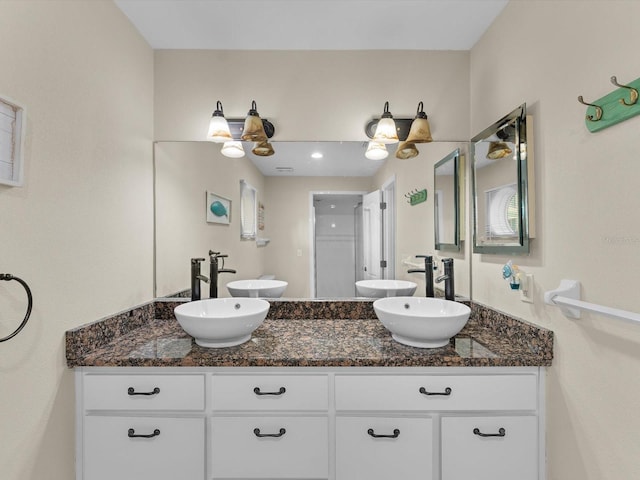 bathroom with vanity and an enclosed shower