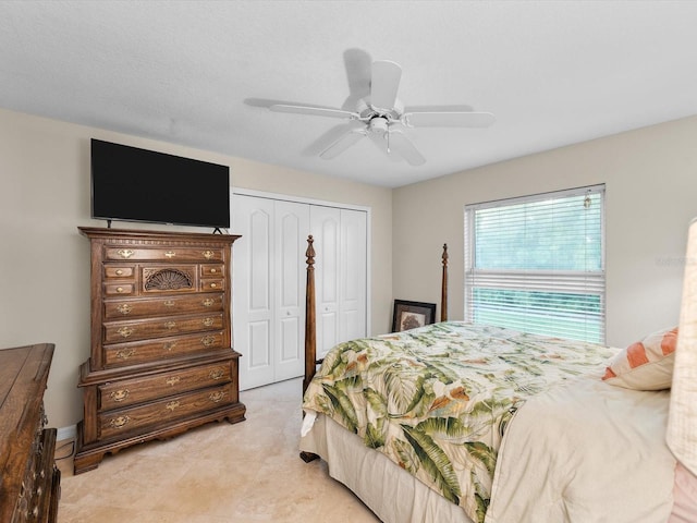 bedroom featuring ceiling fan and a closet