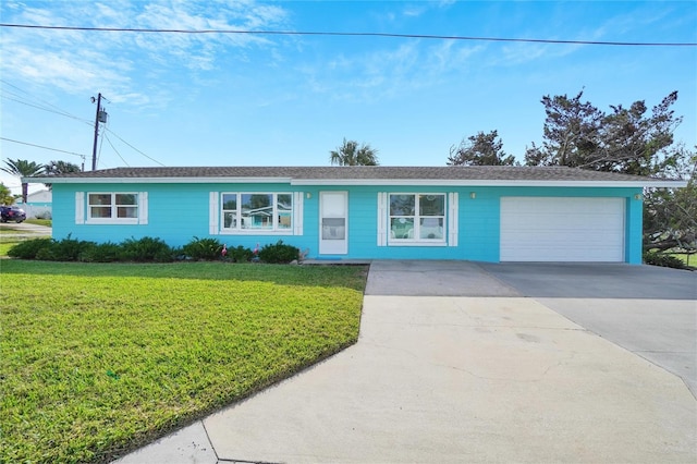 ranch-style house with a garage and a front lawn