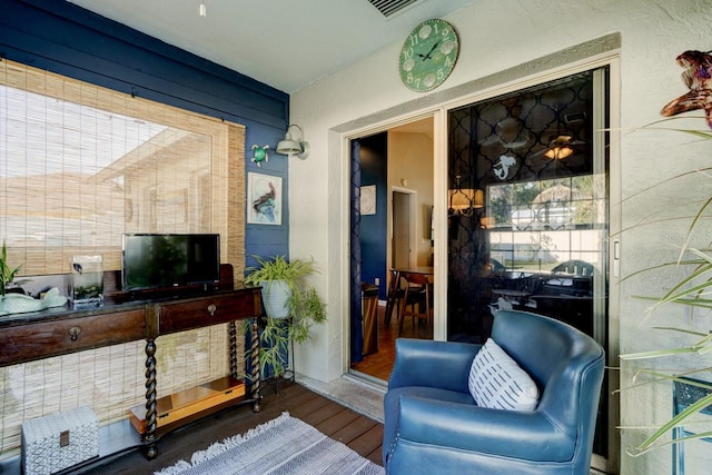 living area with hardwood / wood-style floors