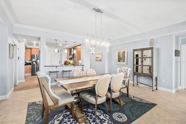 tiled dining area with crown molding, a textured ceiling, and a notable chandelier