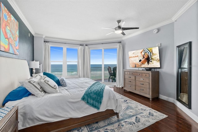 bedroom with access to exterior, ceiling fan, dark hardwood / wood-style floors, and a textured ceiling