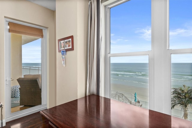 unfurnished dining area with a beach view and a water view