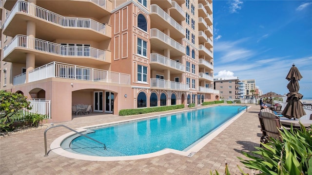 view of pool featuring a patio