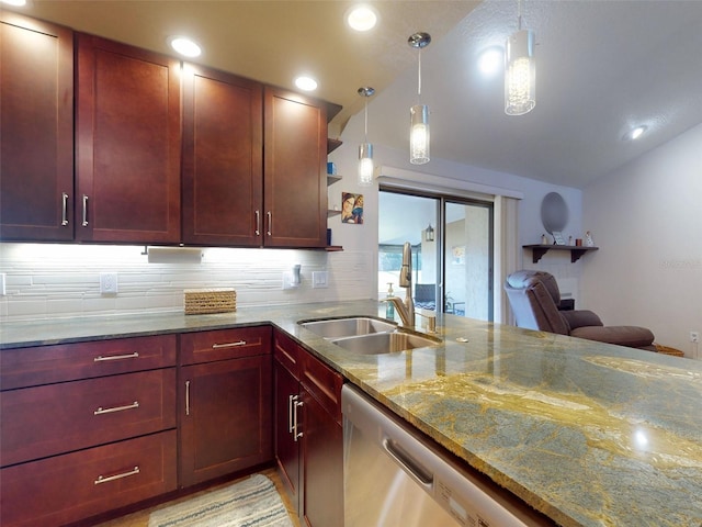 kitchen with sink, backsplash, light stone counters, stainless steel dishwasher, and hanging light fixtures