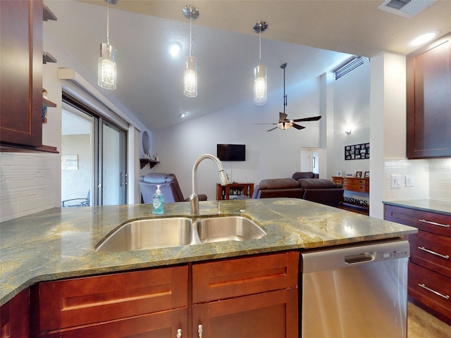 kitchen featuring lofted ceiling, decorative light fixtures, light stone countertops, sink, and stainless steel dishwasher