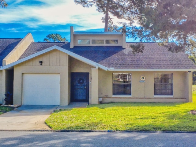 view of front facade with a garage and a front yard