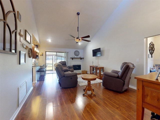 living room with high vaulted ceiling, ceiling fan, dark hardwood / wood-style floors, and sink