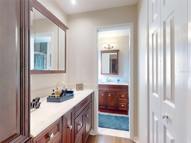 bathroom featuring vanity and wood-type flooring