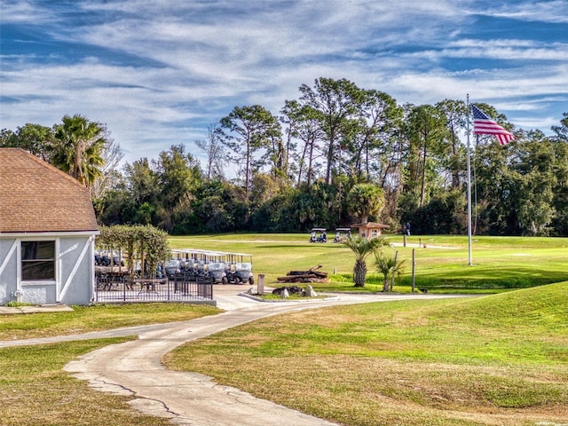 surrounding community featuring a yard