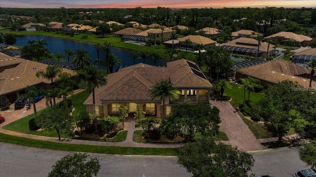 bird's eye view featuring a water view and a residential view