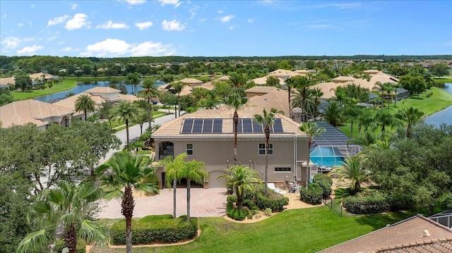 bird's eye view with a water view and a residential view