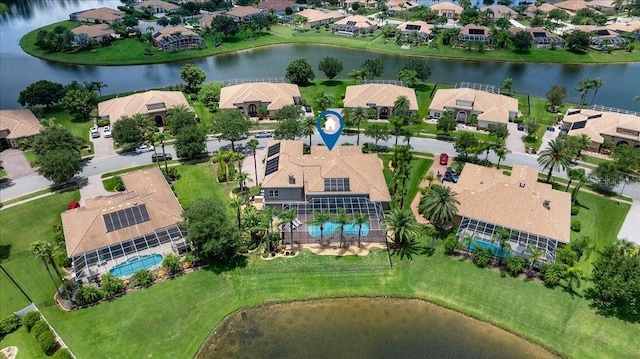 bird's eye view with a water view and a residential view