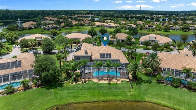 drone / aerial view featuring a water view and a residential view