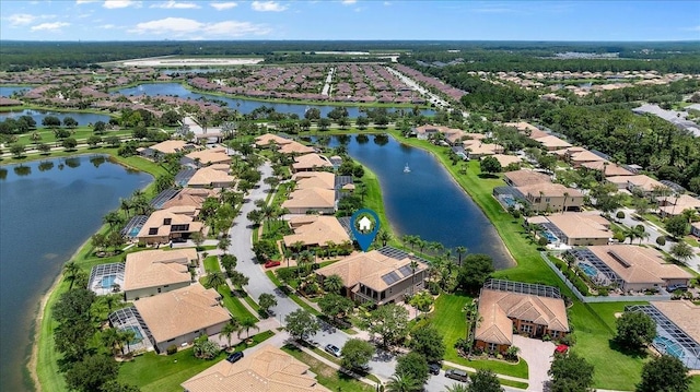 bird's eye view with a water view and a residential view