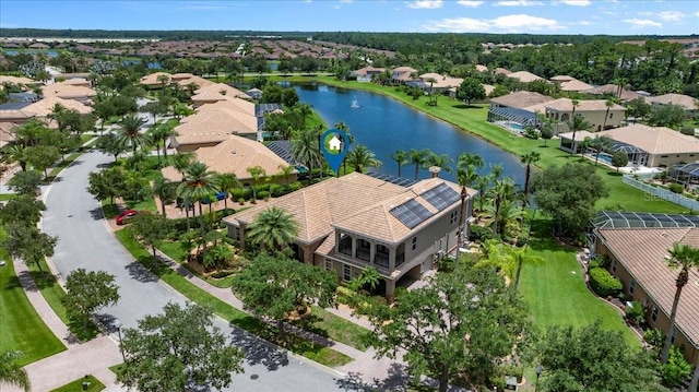 bird's eye view with a water view and a residential view