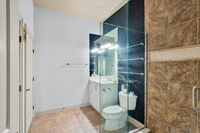 bathroom with toilet, tile patterned floors, baseboards, and vanity