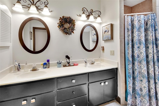 bathroom with vanity and curtained shower