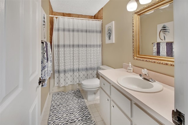 full bathroom with tile patterned floors, a textured ceiling, vanity, shower / bathtub combination with curtain, and toilet