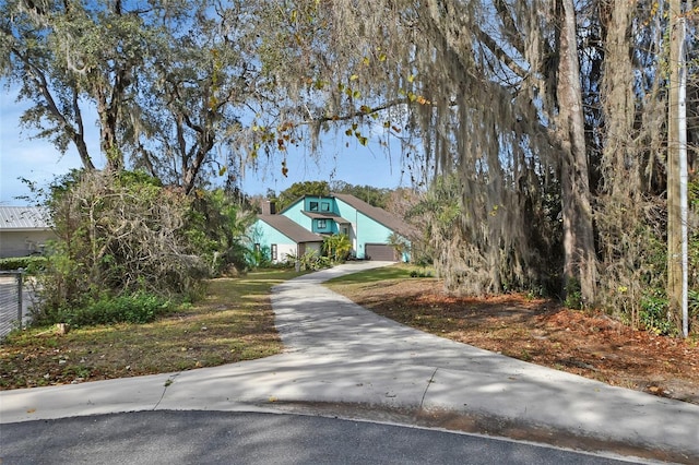 view of property hidden behind natural elements