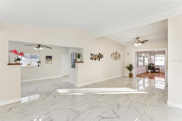 empty room featuring beamed ceiling and ceiling fan