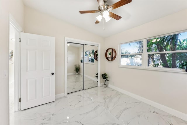 unfurnished bedroom with a closet and ceiling fan