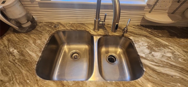 interior details featuring stone counters and sink