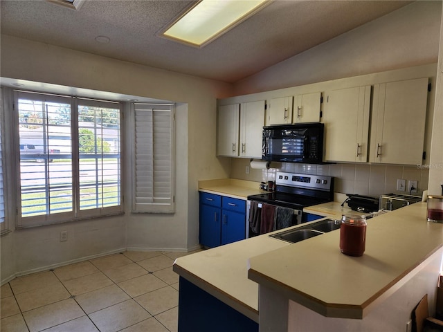 kitchen featuring white cabinetry, electric range, blue cabinets, kitchen peninsula, and lofted ceiling