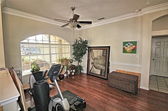 home office with ceiling fan, crown molding, dark hardwood / wood-style floors, and a textured ceiling