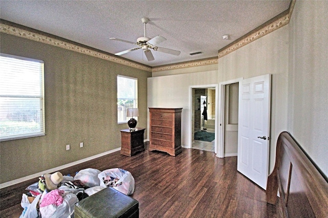 bedroom featuring a textured ceiling, ceiling fan, and dark wood-type flooring