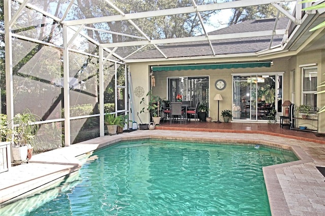 view of pool with a lanai and a patio area