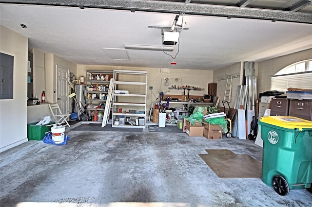 garage featuring electric panel and a garage door opener