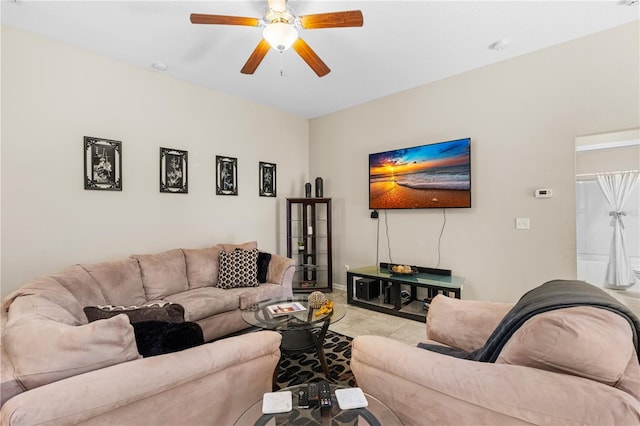 living room featuring ceiling fan and light tile patterned floors