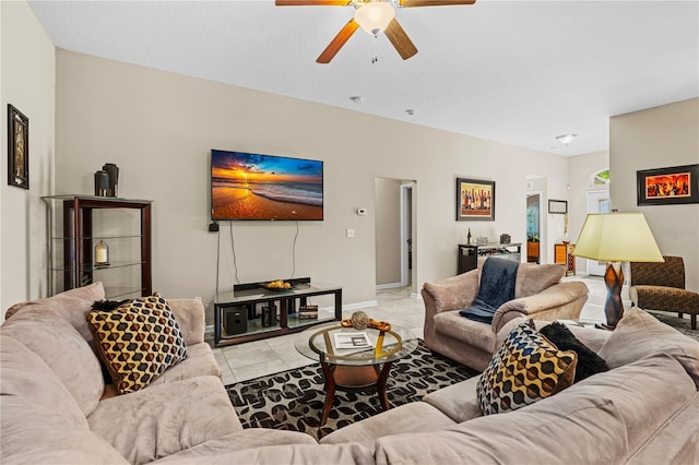 tiled living room featuring ceiling fan