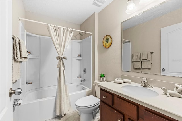 full bathroom with a textured ceiling, vanity, toilet, and shower / bath combo with shower curtain