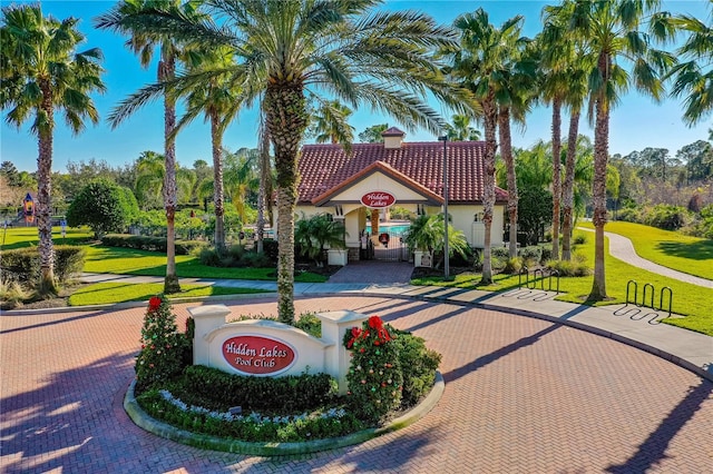 mediterranean / spanish home featuring a front lawn