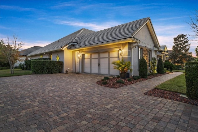 view of front of property with a garage