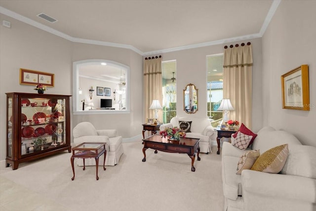 carpeted living room with ornamental molding