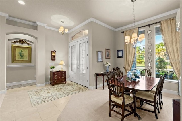 tiled dining area featuring crown molding and a notable chandelier