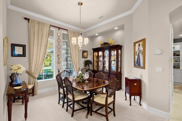 carpeted dining space featuring crown molding and a chandelier