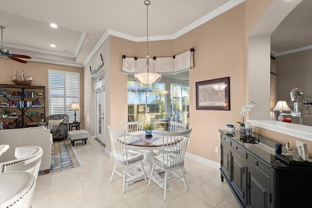 dining area featuring crown molding, light tile patterned floors, and ceiling fan