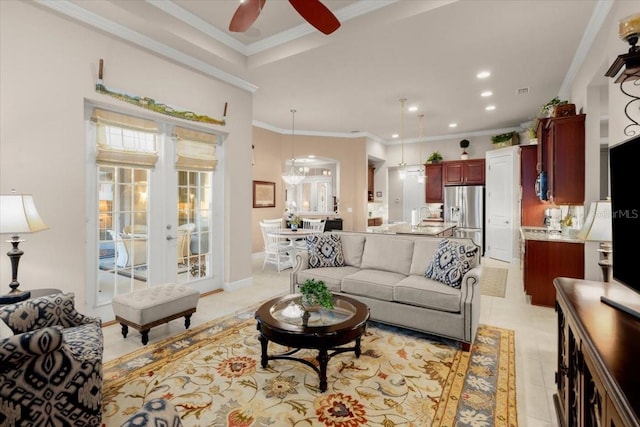 tiled living room with ceiling fan, french doors, and crown molding